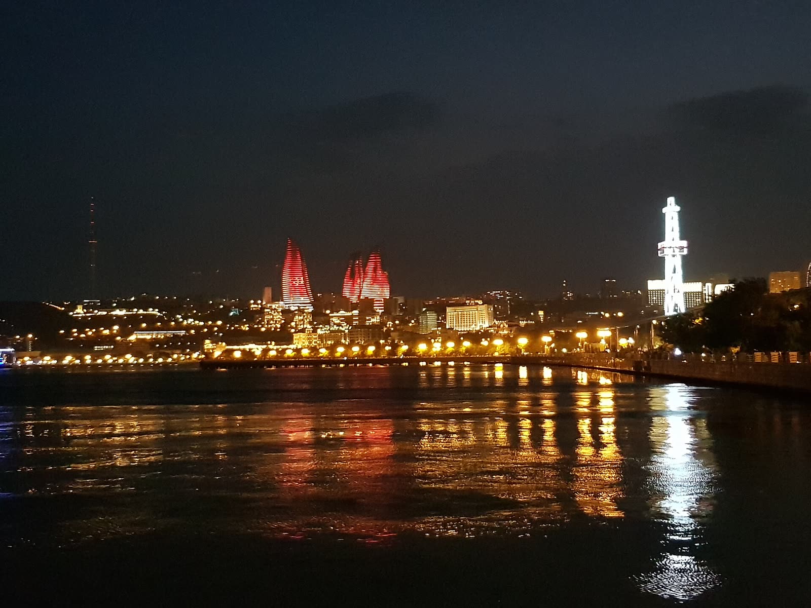 Flame Towers lit above the Baku skyline at night, Azerbaijan