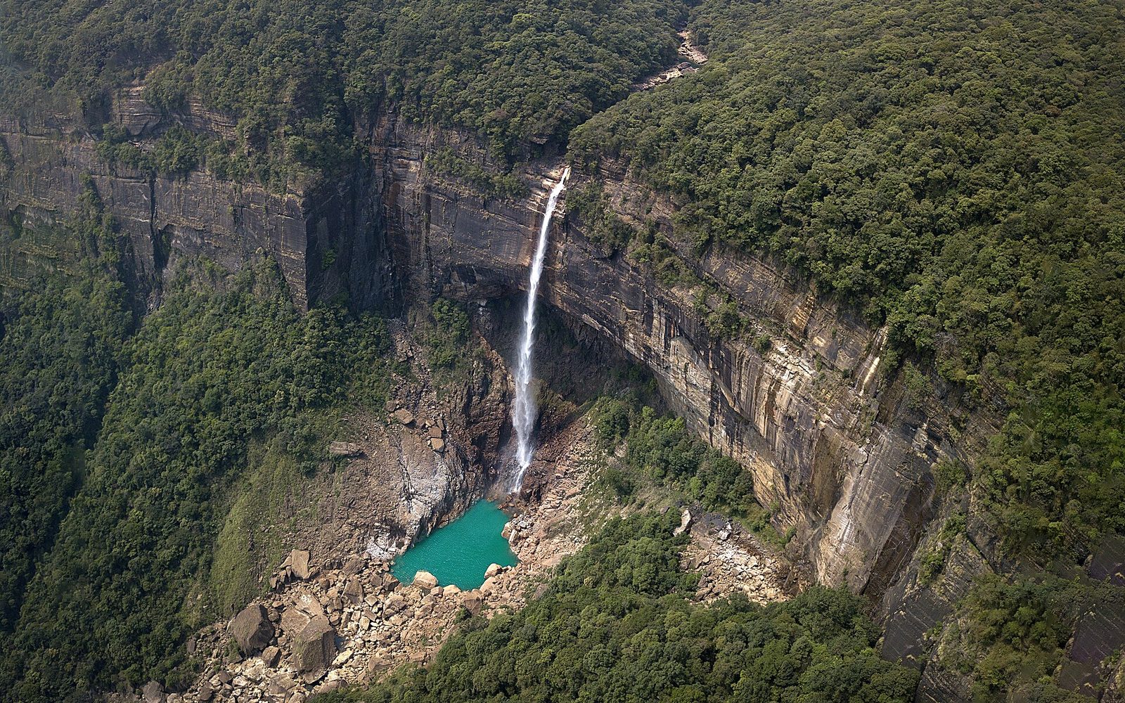 Waterfall framed by green hills, a romantic Meghalaya backdrop